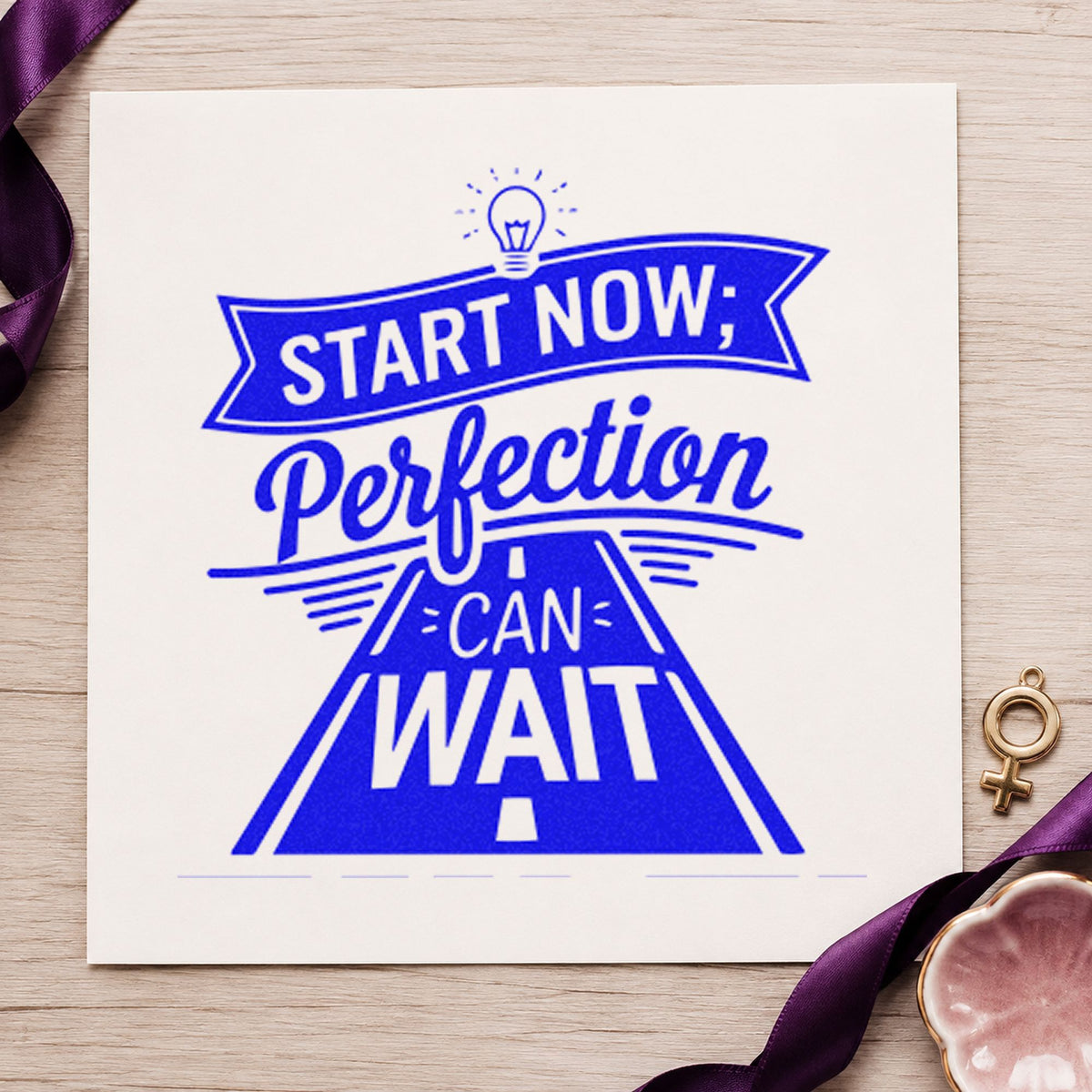 Start Now Perfection Road craft stamp imprinted in blue ink on paper, a design suited to framed driveway wall.