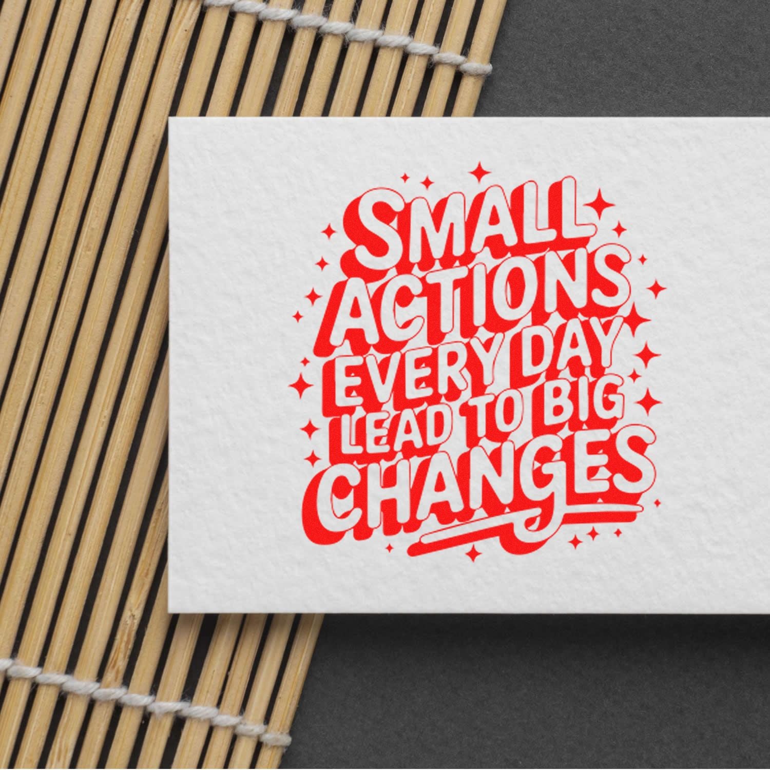 Motivational rubber stamp imprint reading Small Actions Every Day Lead to Big Changes in bold red lettering.