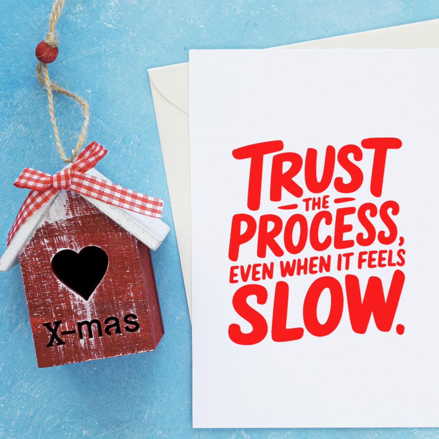 Handmade Christmas birdhouse ornament and greeting card showing a motivational rubber stamp message: Trust the process, even when it feels slow.
