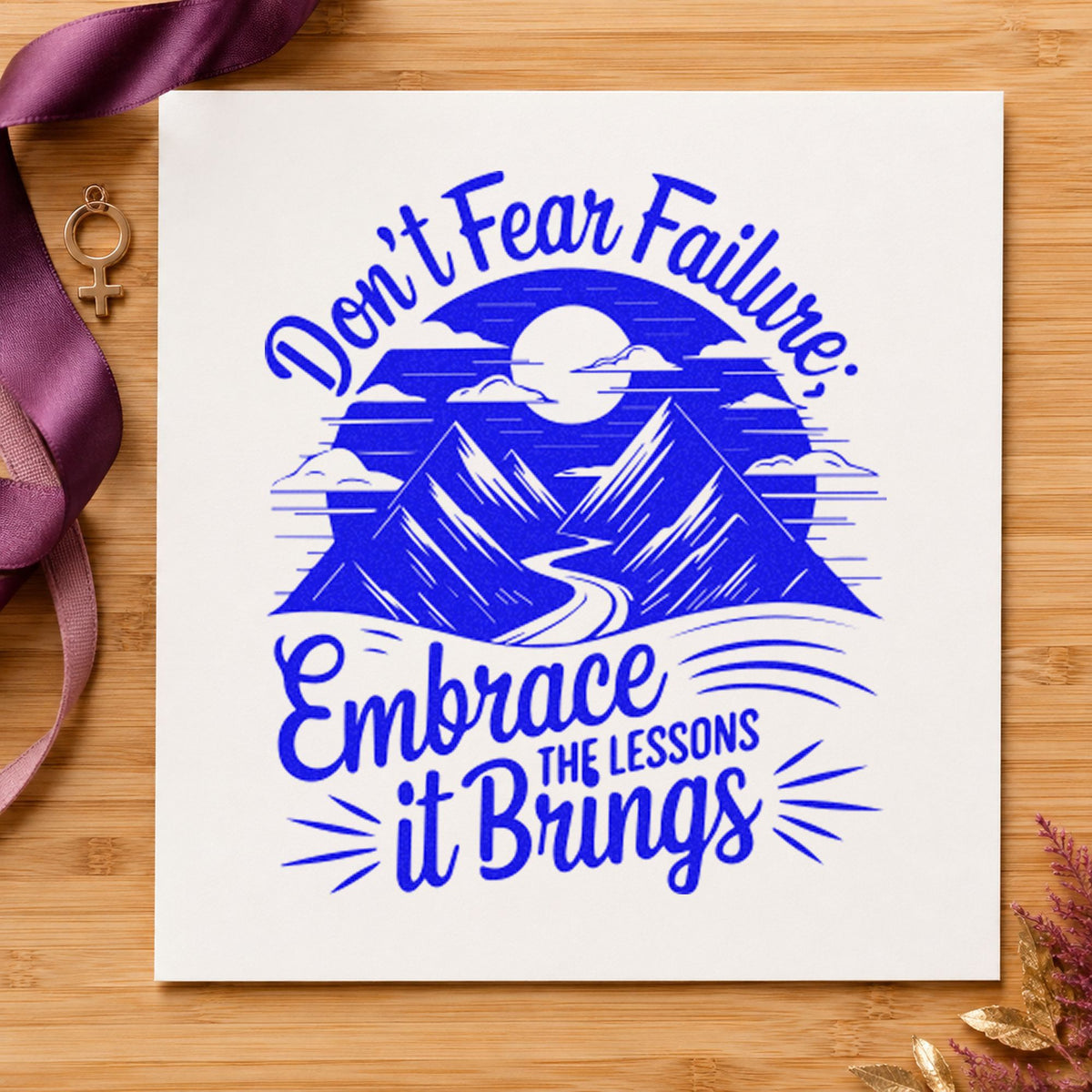 Embrace Lessons Failure Mountains craft stamp imprinted in blue ink on paper, a design suited to framed practice room.