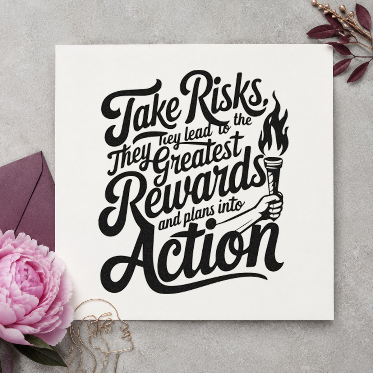 Take Risks Rewards Action craft stamp imprint in black ink on a handmade project, one idea being baton gift tags.
