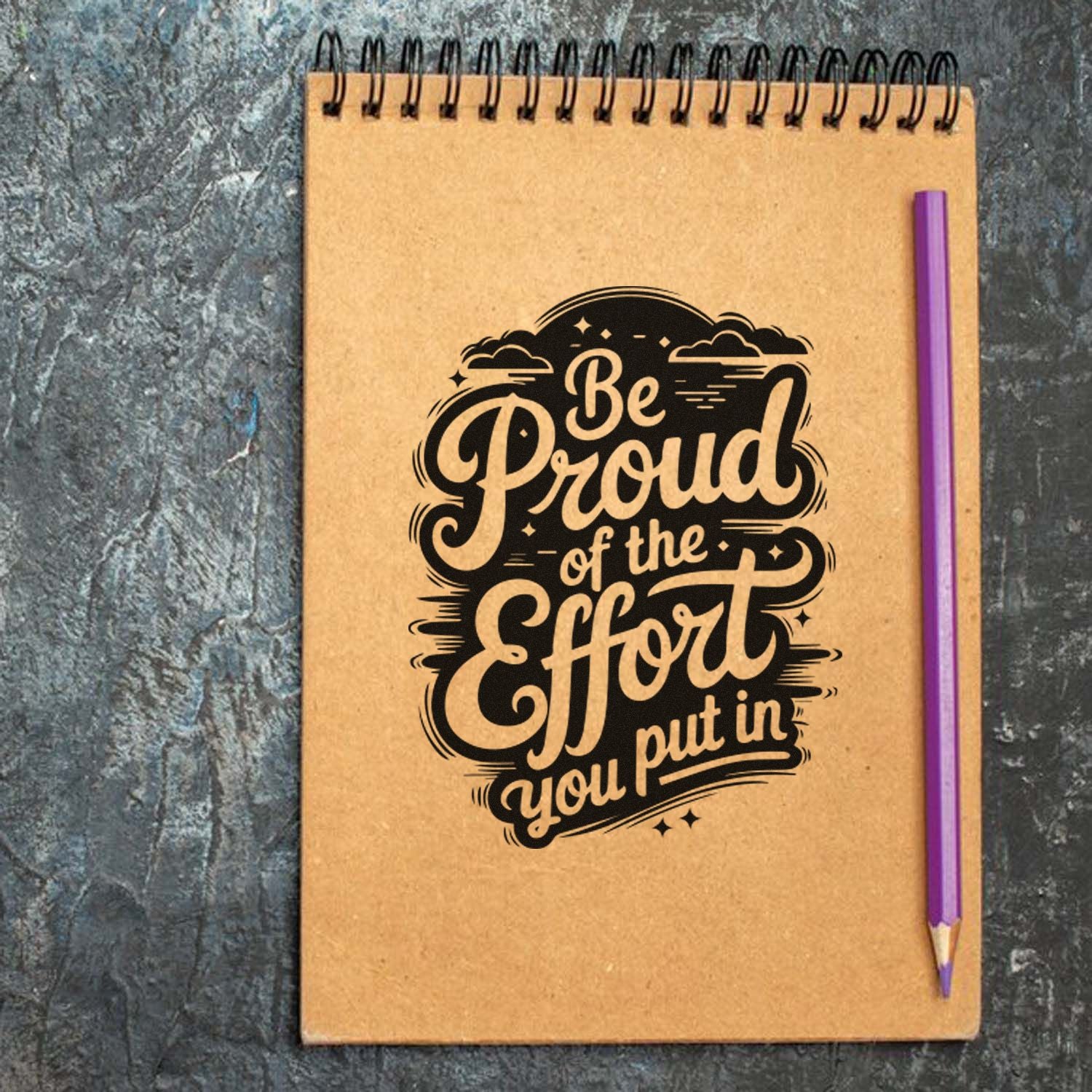 Custom rubber stamp on notebook with motivational quote, Be Proud of the Effort you put in.