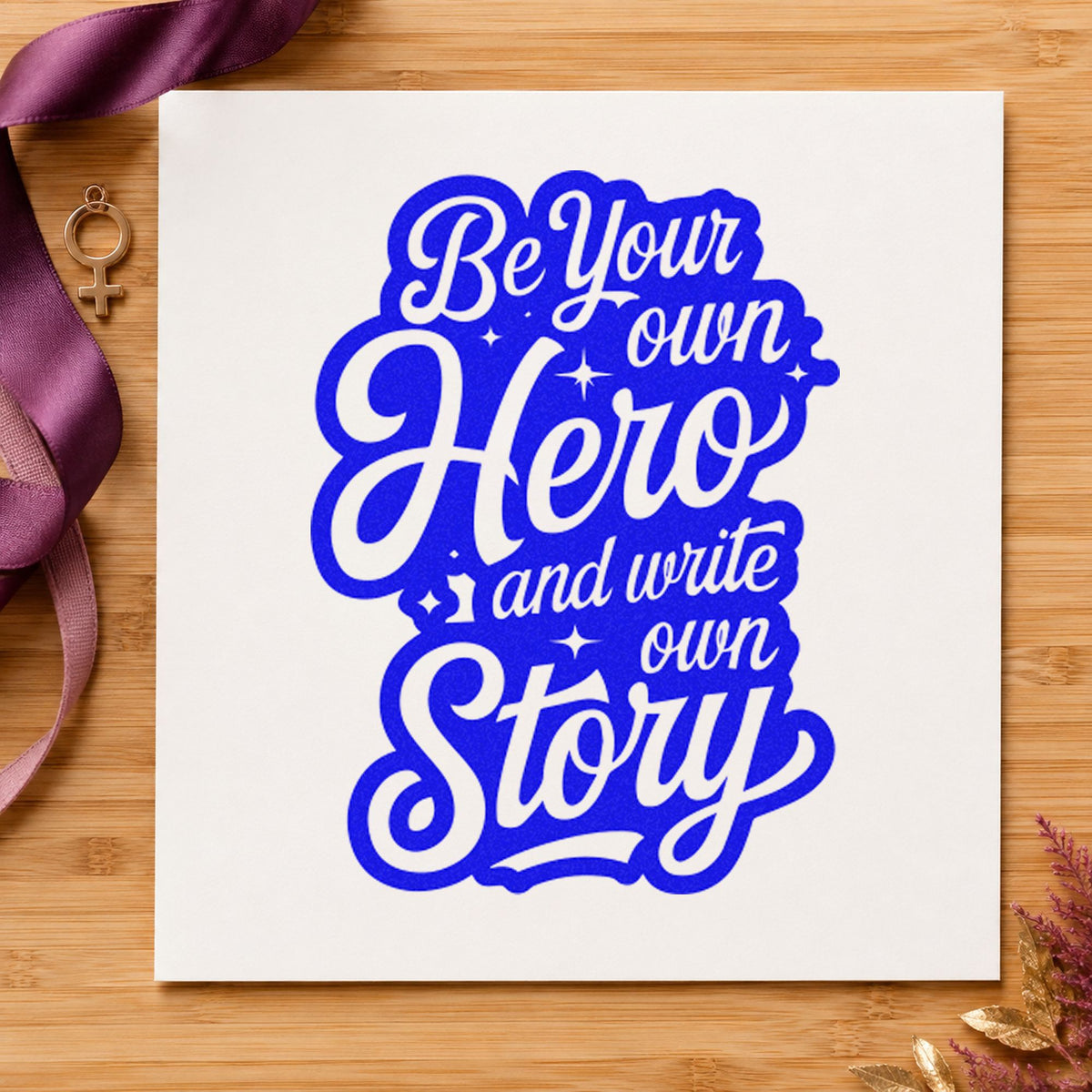 Own Hero Own Story craft stamp imprinted in blue ink on paper, a design suited to framed game room.
