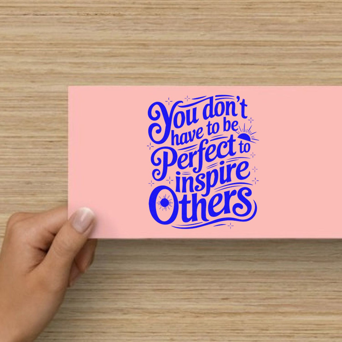 Inspire Others Without Perfection rubber stamp shown in blue ink, stamped for projects such as sideline album page.