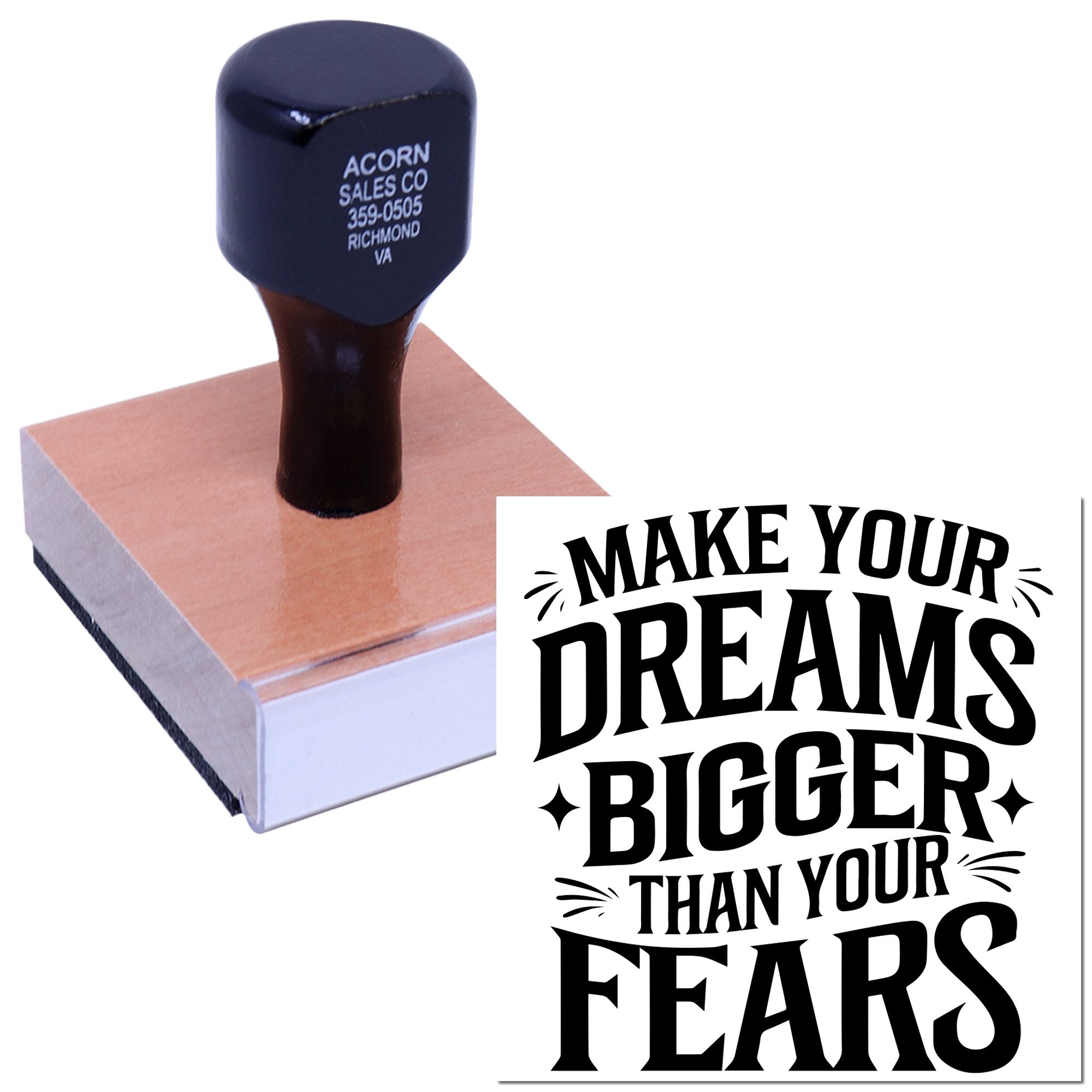 Custom rubber stamp with motivational quote, shown imprinting Make your dreams bigger than your fears on a block.