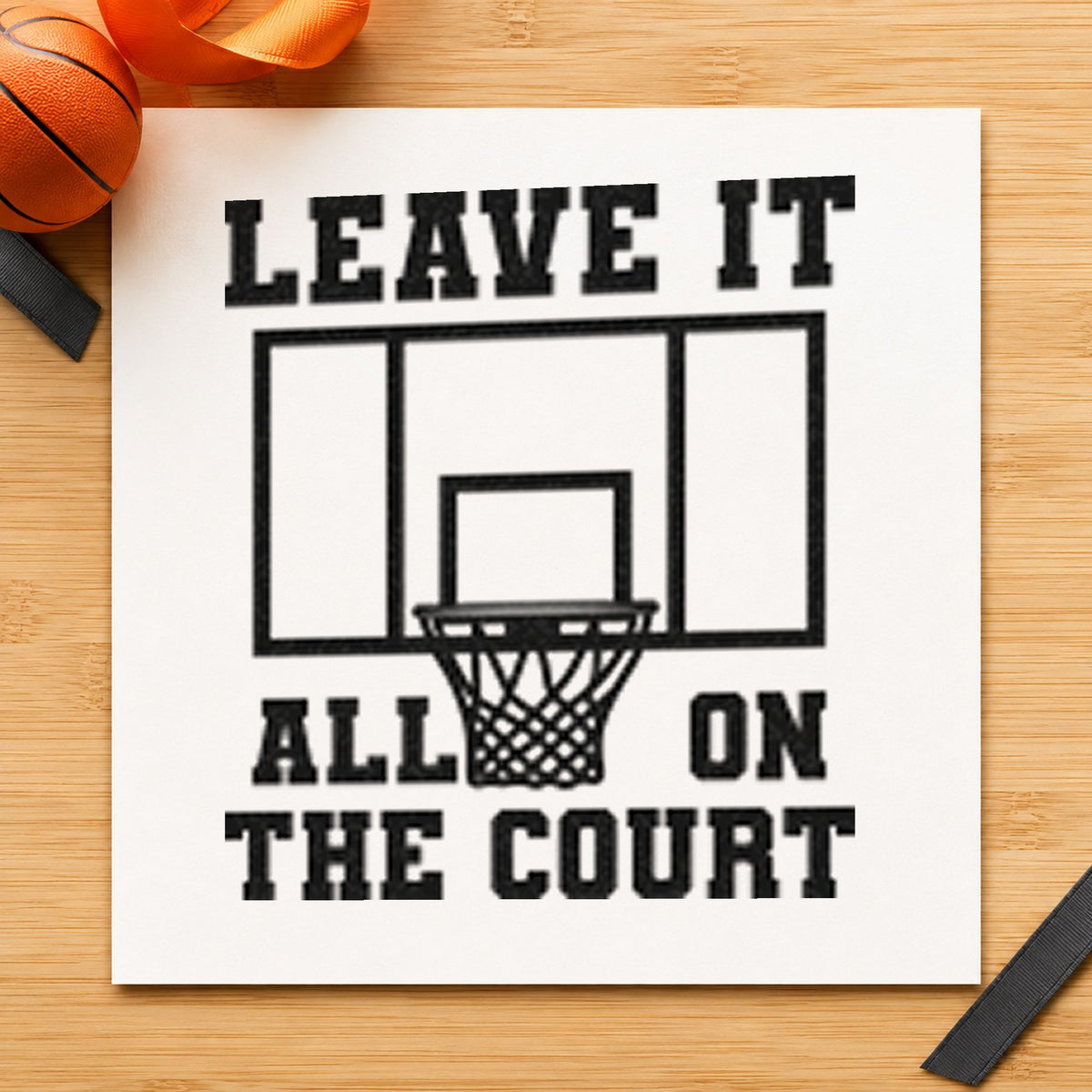 Leave All On Court craft stamp imprint in black ink on a handmade project, one idea being center court tags.