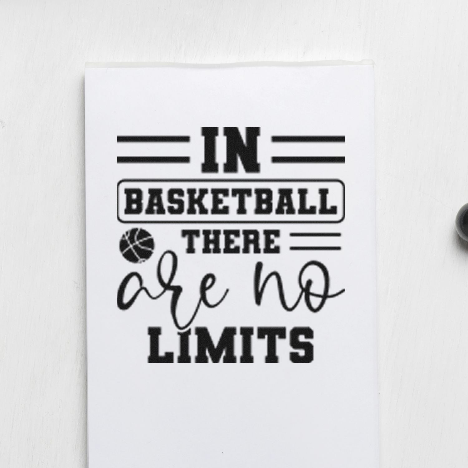 Basketball rubber stamp design reading In basketball there are no limits with basketball icon and bold sports typography.