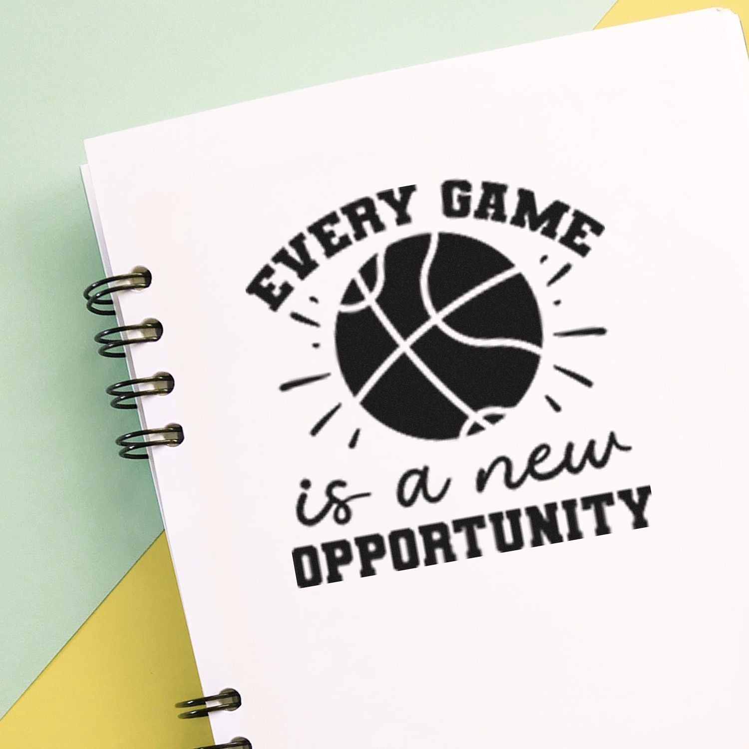 Basketball rubber stamp imprint reading Every game is a new opportunity for motivational sports-themed crafts and stationery.