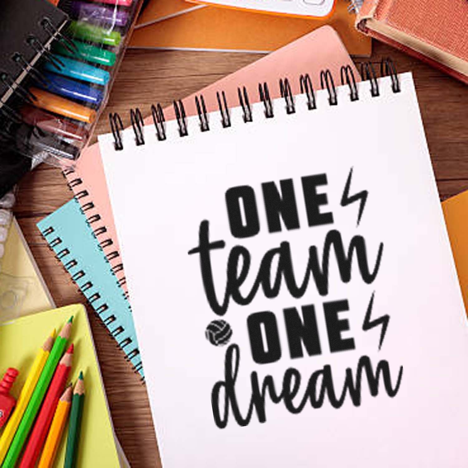 One Team One Dream motivational rubber stamp design on notebook, ideal for sports team and school craft projects.