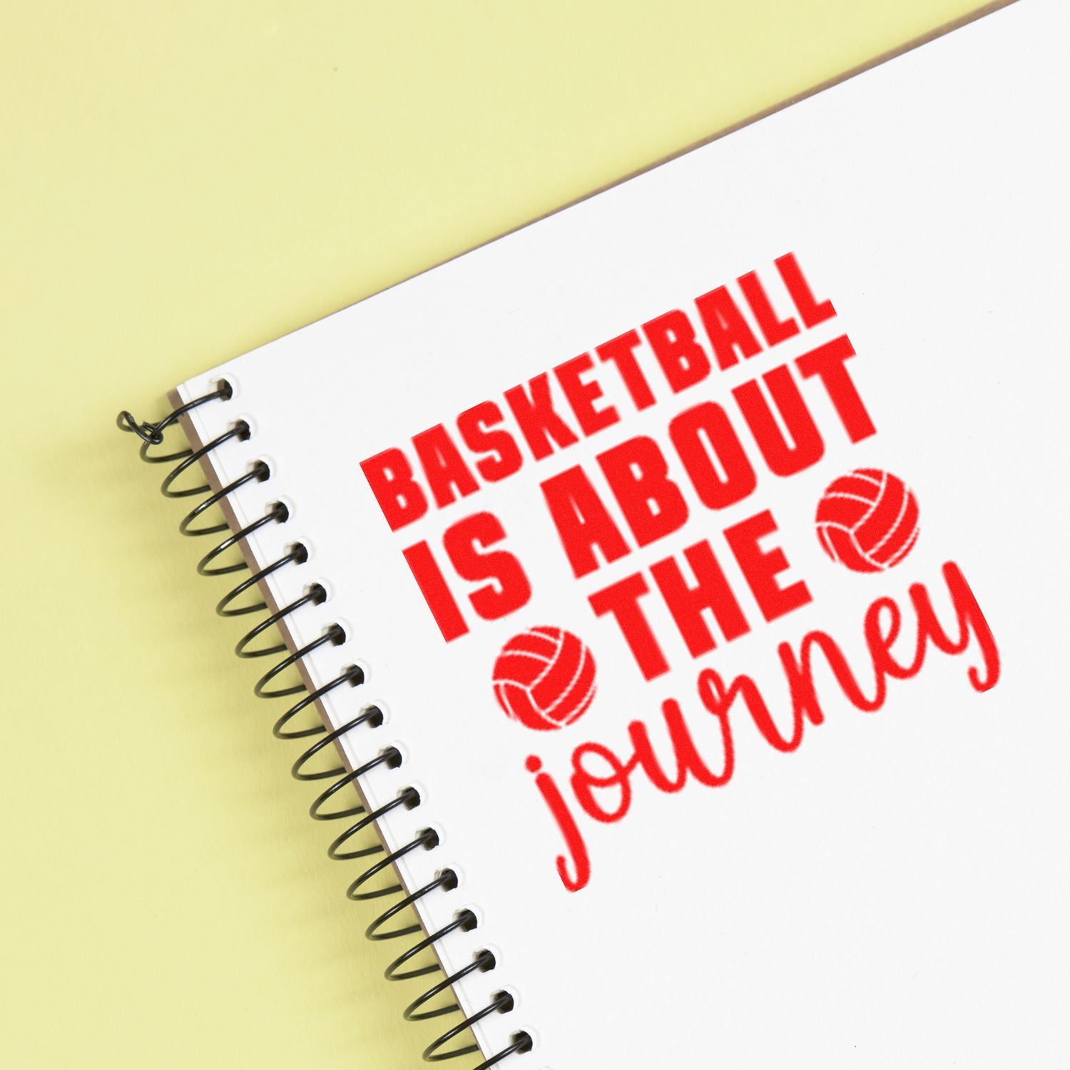 Basketball-themed custom rubber stamp reading Basketball is about the journey with basketball icons on a notebook.