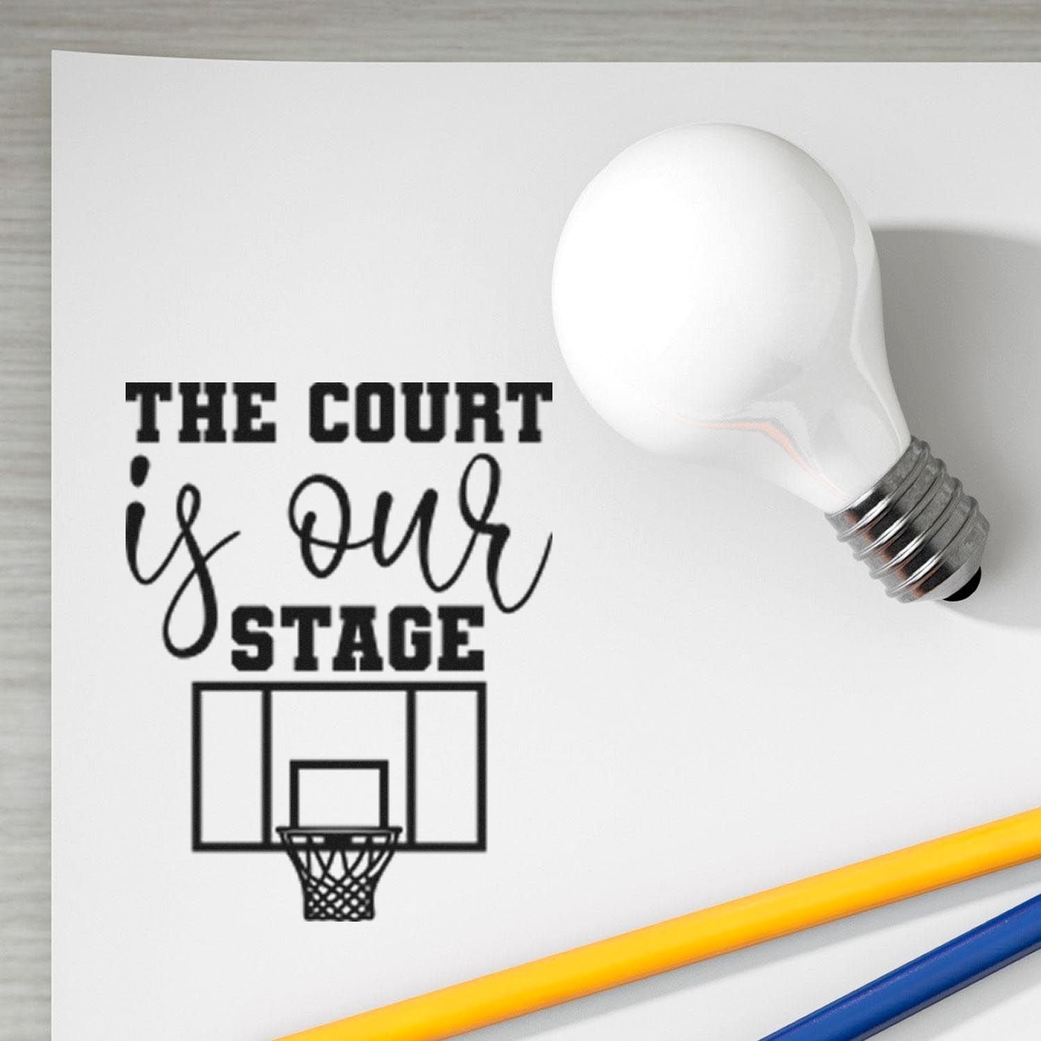 Basketball rubber stamp design reading The Court Is Our Stage with hoop graphic, ideal for custom sports stamps.