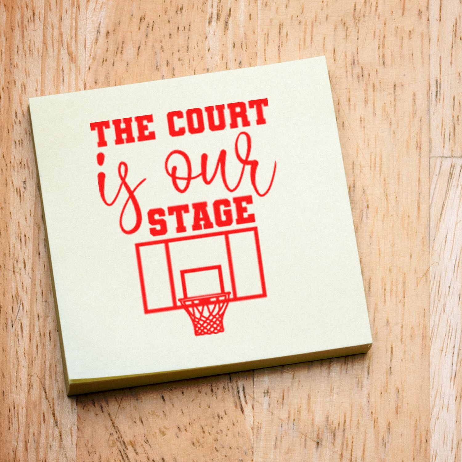 Basketball rubber stamp design reading The Court Is Our Stage with hoop graphic for sports-themed crafts, cards, and branding.
