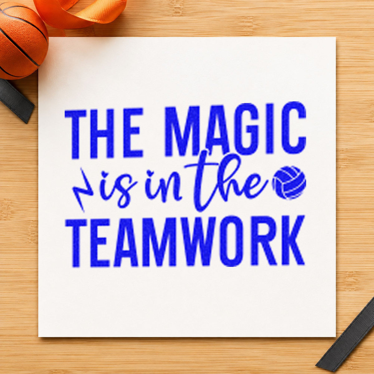 Magic Is In Teamwork craft stamp in blue ink on cardstock, an easy option for shirt panel printing.