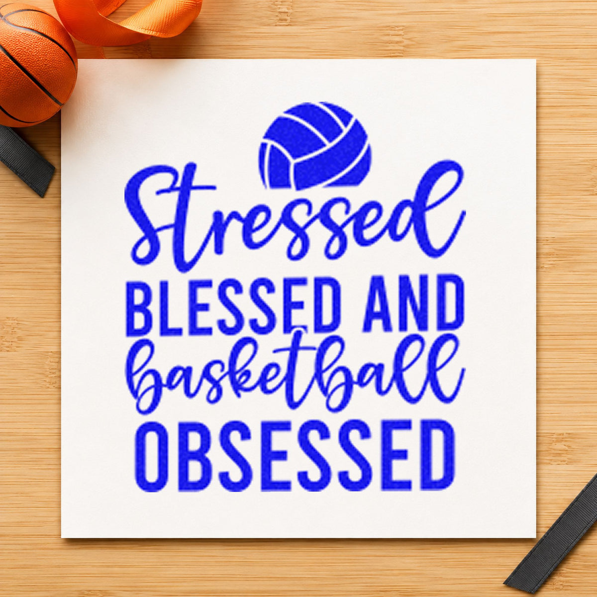 Stressed Blessed Basketball Obsessed craft stamp imprinted in blue ink on paper, a design suited to framed garage door.