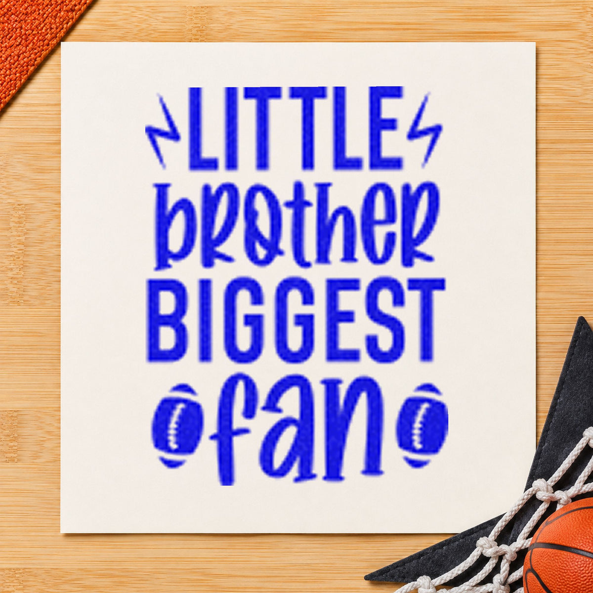 Little Brother Biggest Fan craft stamp imprinted in blue ink on paper, a design suited to framed playroom wall.