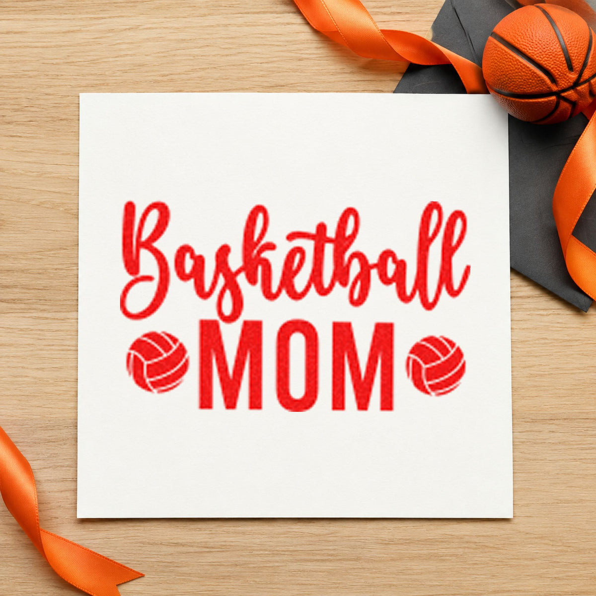 Basketball Mom Paneled Balls craft stamp imprint in red ink on a handmade project, one idea being wash care cards.