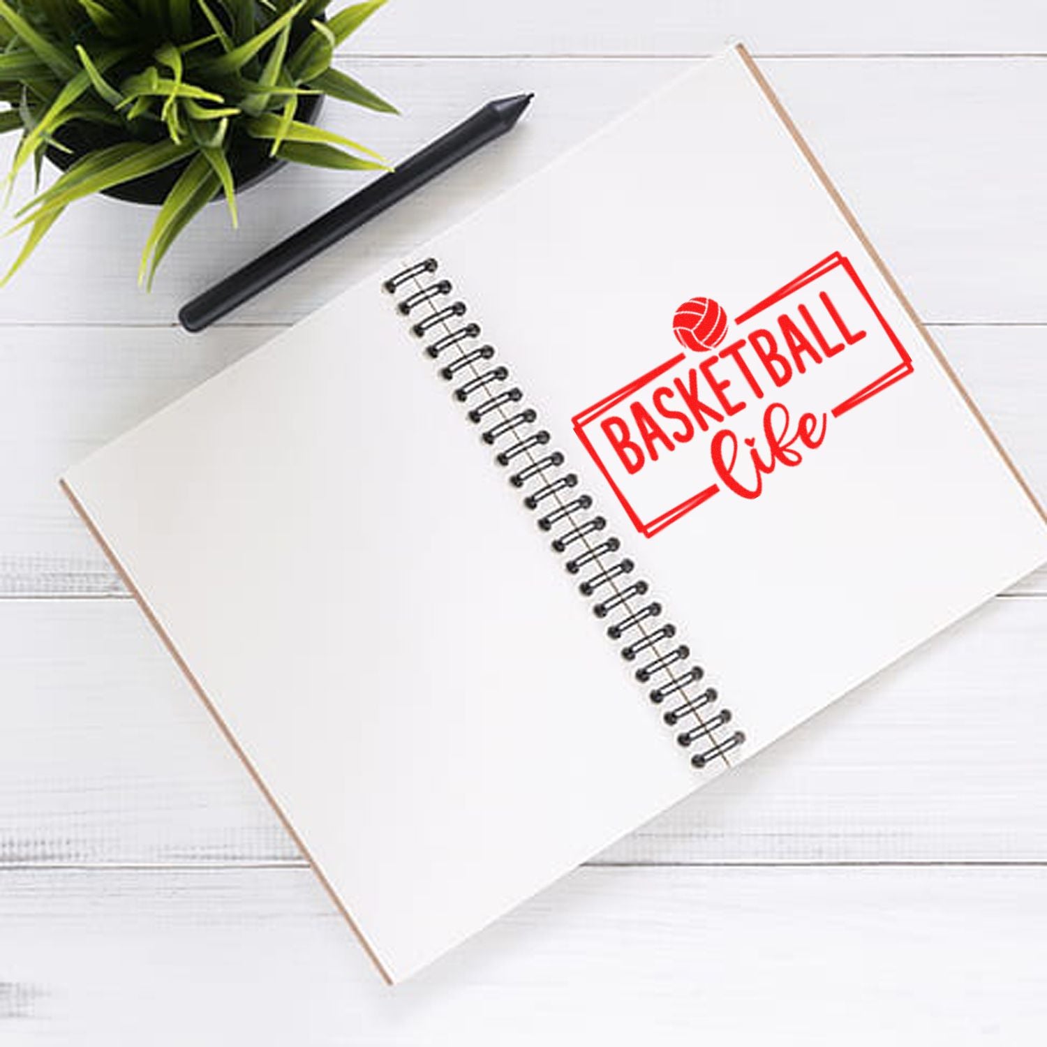 Basketball life rubber stamp design on open notebook, ideal for sports-themed custom stamping and crafting projects.
