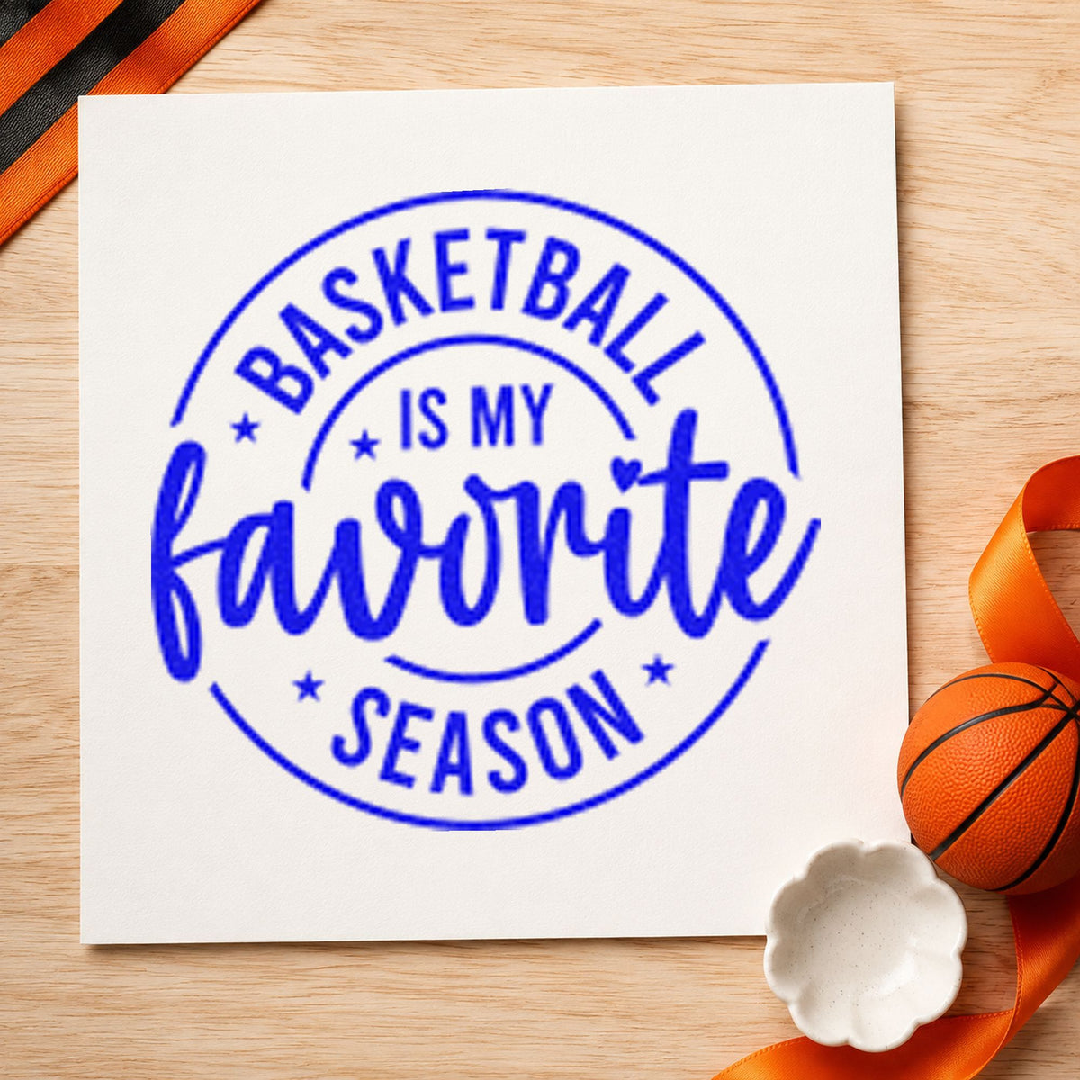 Basketball Favorite Season Badge craft stamp imprinted in blue ink on paper, a design suited to framed hall shelf.