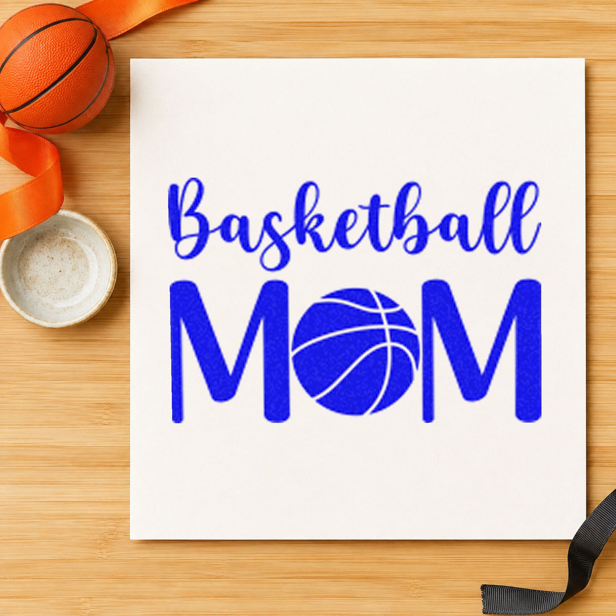 Basketball Mom Ball Letter craft stamp in blue ink on cardstock, an easy option for tote panel printing.