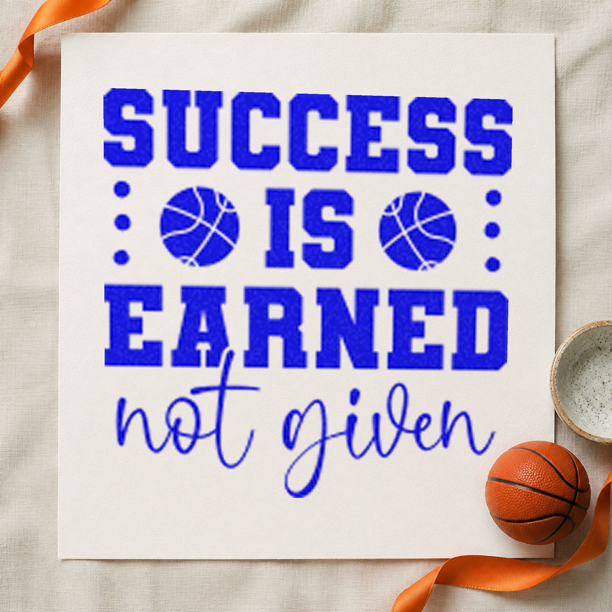 Success Earned Not Given craft stamp imprinted in blue ink on paper, a design suited to framed practice gym.
