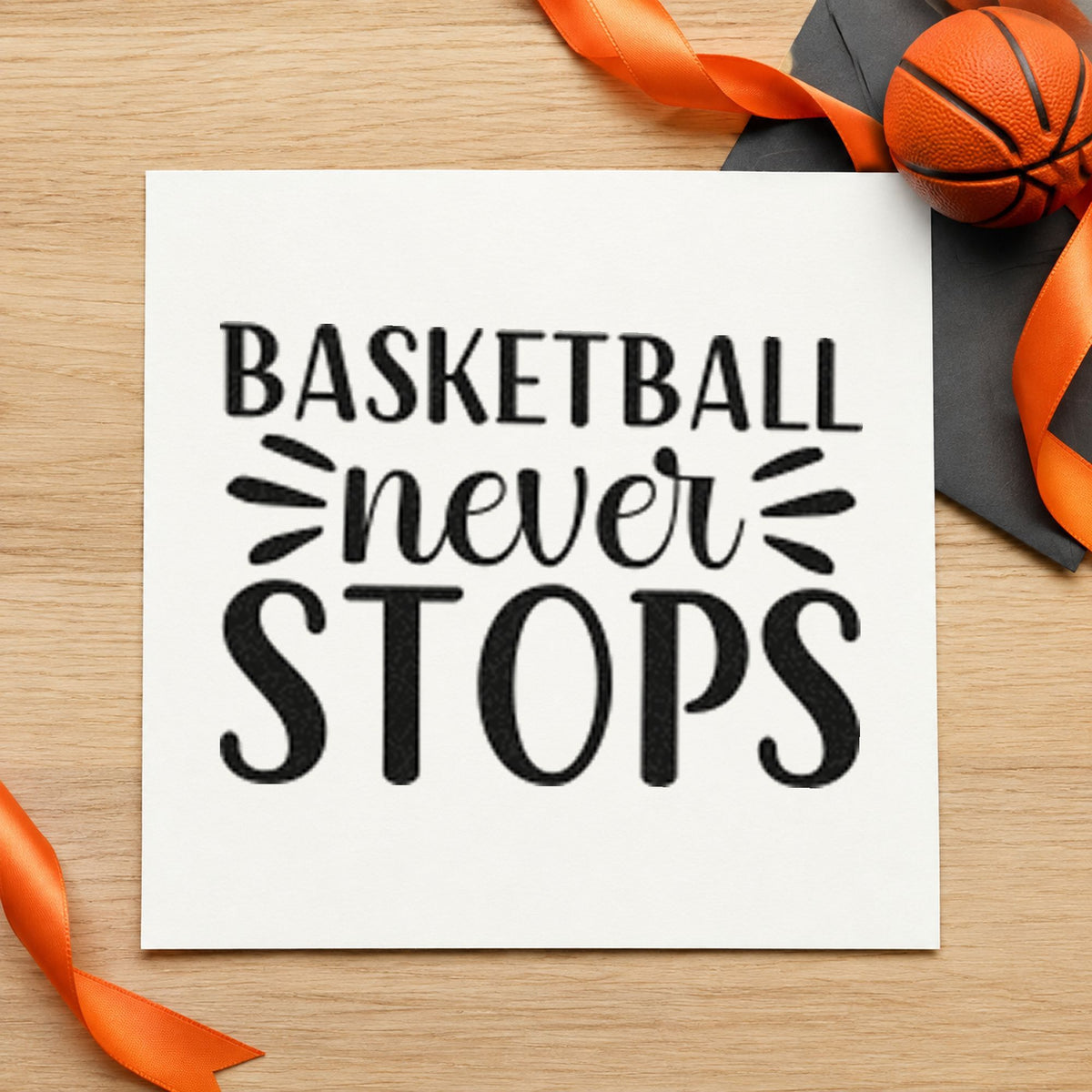 Basketball Never Stops Lettering craft stamp imprint in black ink on a handmade project, one idea being season kit gift tags.