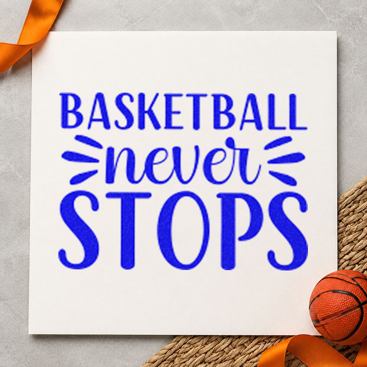 Basketball Never Stops Lettering craft stamp imprinted in blue ink on paper, a design suited to framed garage gym.