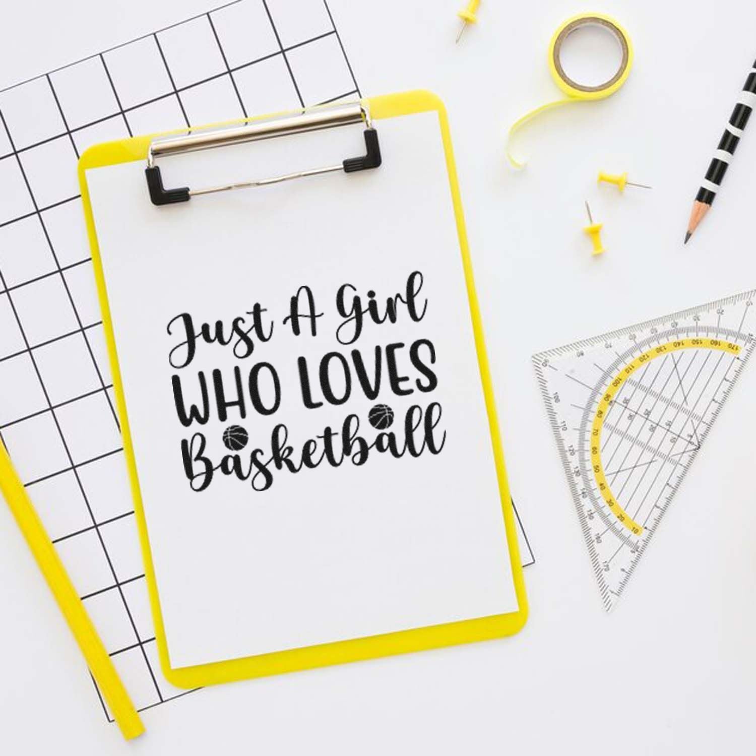 Custom basketball rubber stamp design reading Just a Girl Who Loves Basketball on a clipboard with stationery.