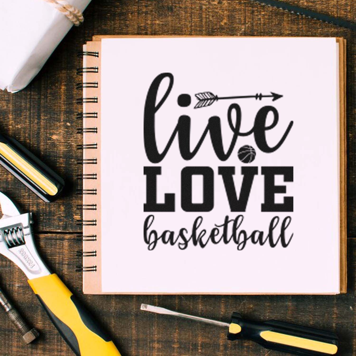 Live Love Basketball rubber stamp design on a notebook, perfect for sports-themed crafts, journaling and DIY stamping.
