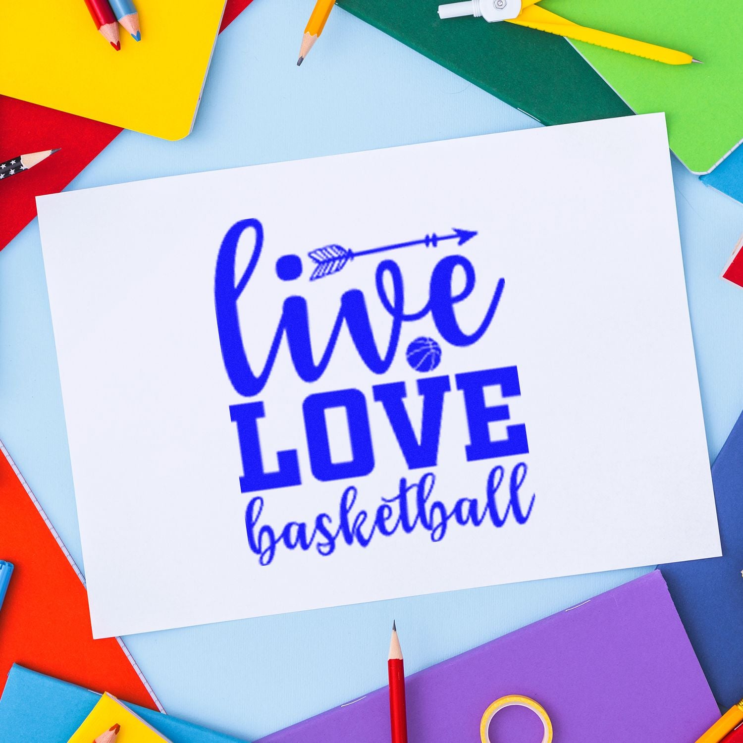 Live Love Basketball rubber stamp design on white paper, surrounded by colorful school supplies.