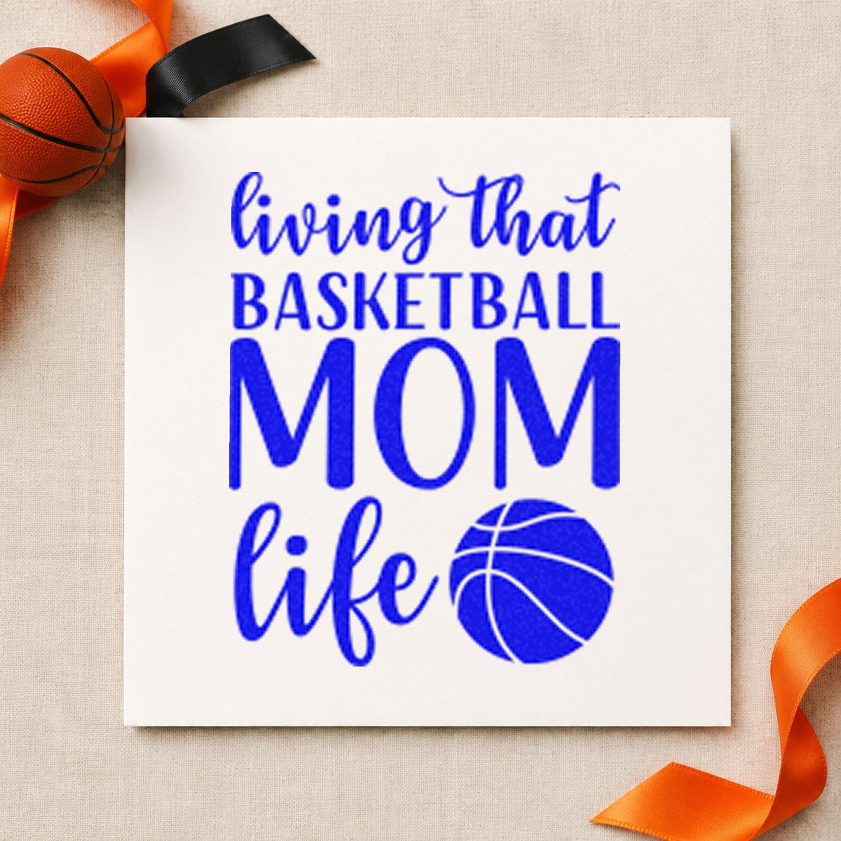 Living Basketball Mom Life craft stamp imprinted in blue ink on paper, a design suited to framed gym foyer.