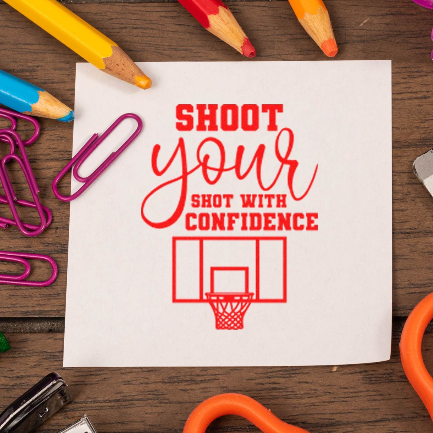 Motivational basketball rubber stamp reading Shoot your shot with confidence on white paper, perfect for sports crafts and encouragement.