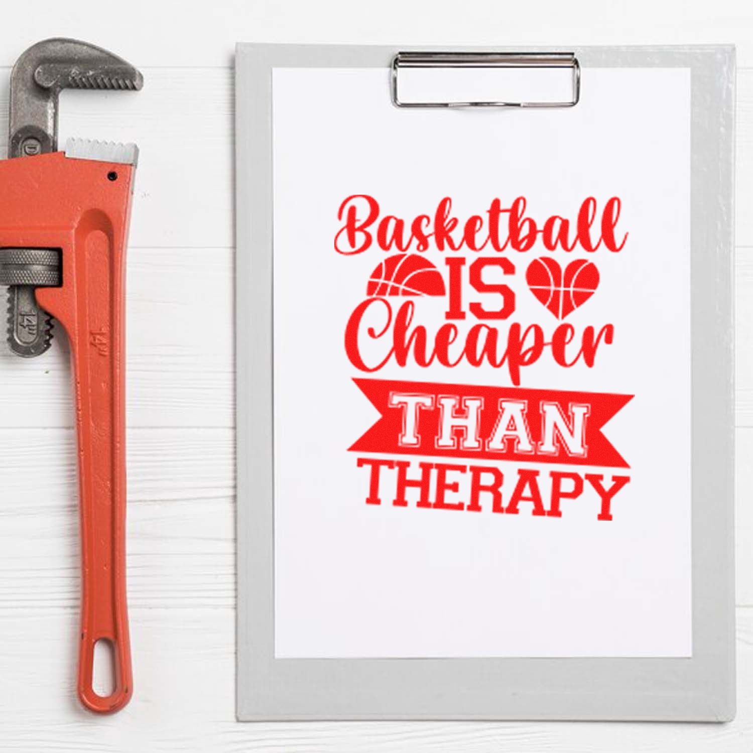 Basketball is cheaper than therapy rubber stamp design on clipboard, paired with a wrench for DIY sports crafting.