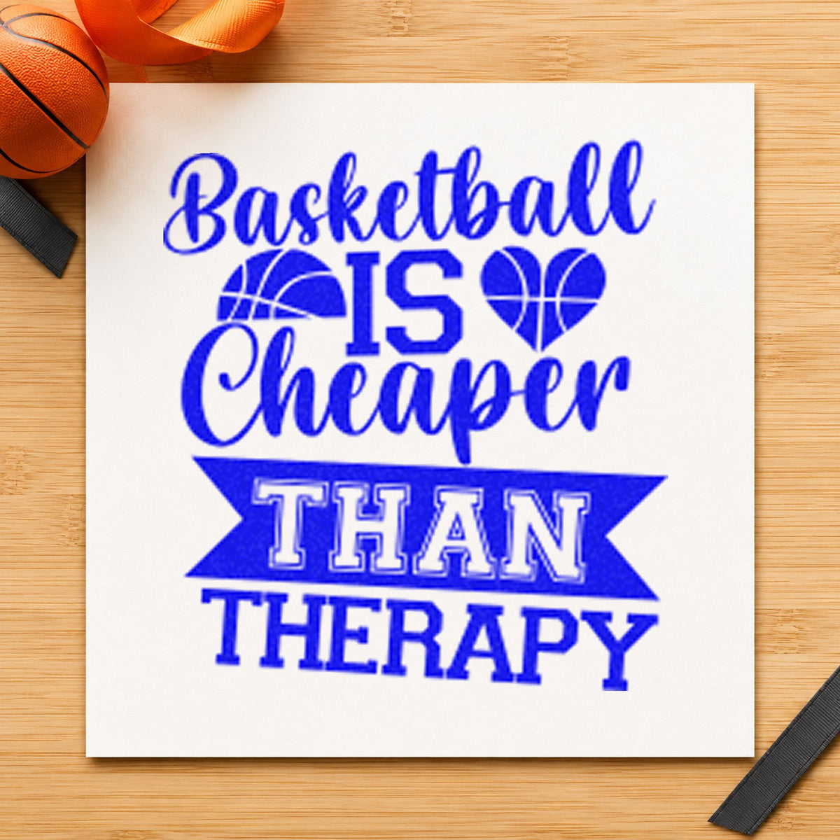 Basketball Cheaper Than Therapy craft stamp imprinted in blue ink on paper, a design suited to framed gym corridor.