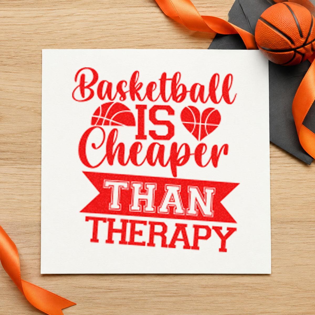 Basketball Cheaper Than Therapy rubber stamp shown in red ink, stamped for projects such as bin kit labels.