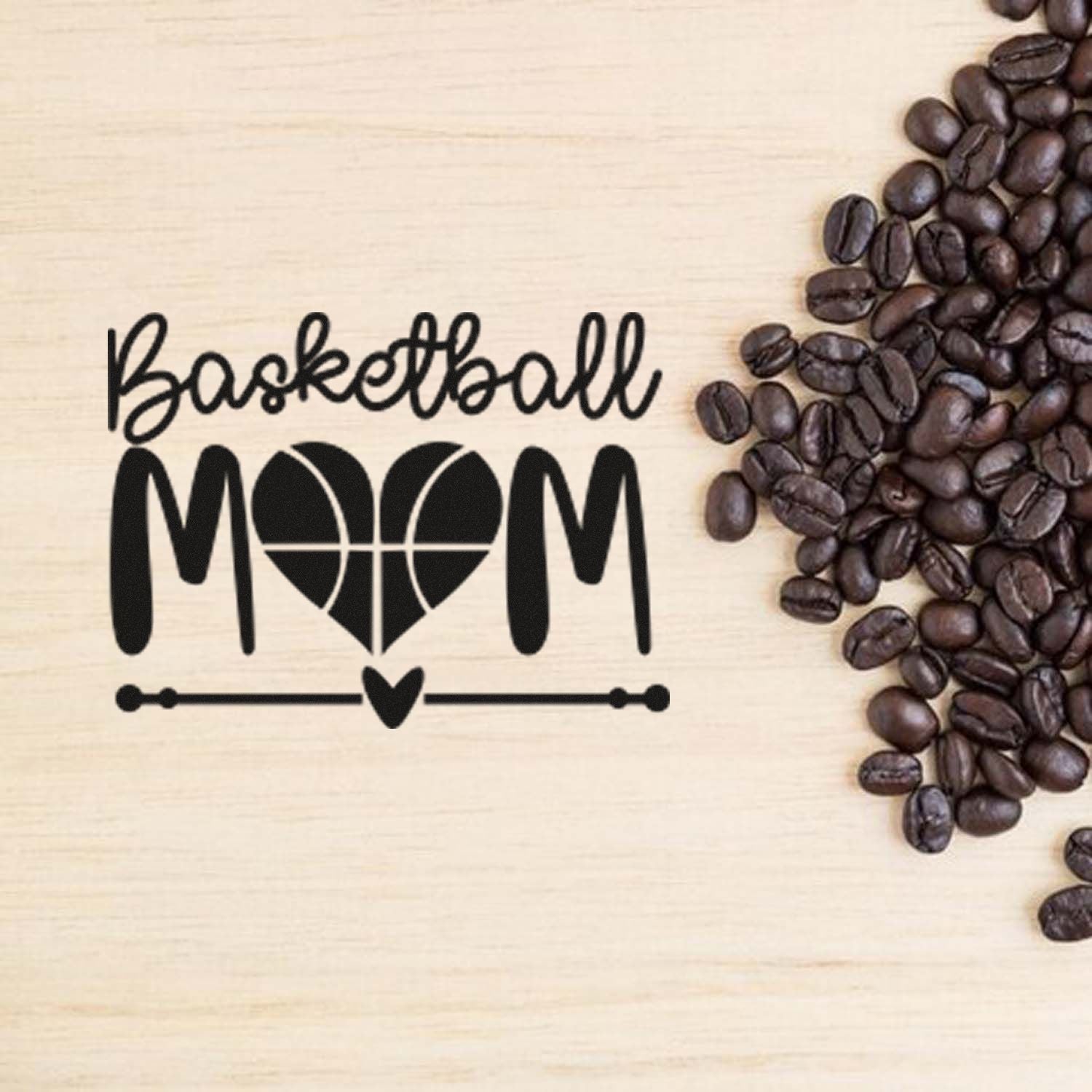 Basketball Mom rubber stamp design with heart basketball graphic, displayed on wood background with coffee beans.