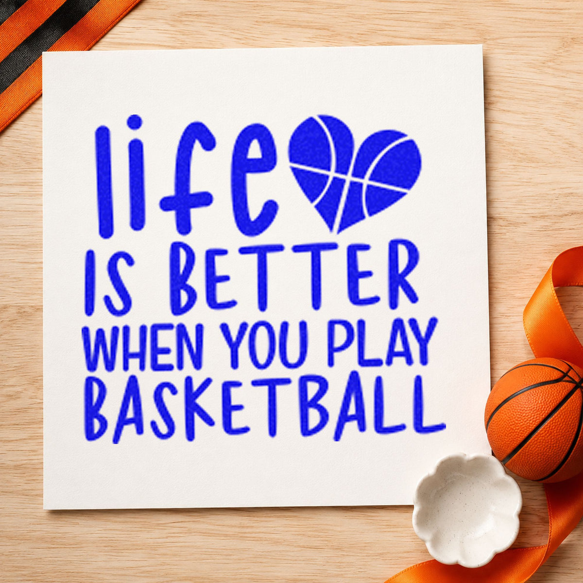 Life Better Playing Basketball craft stamp in blue ink on cardstock, an easy option for bench towel printing.