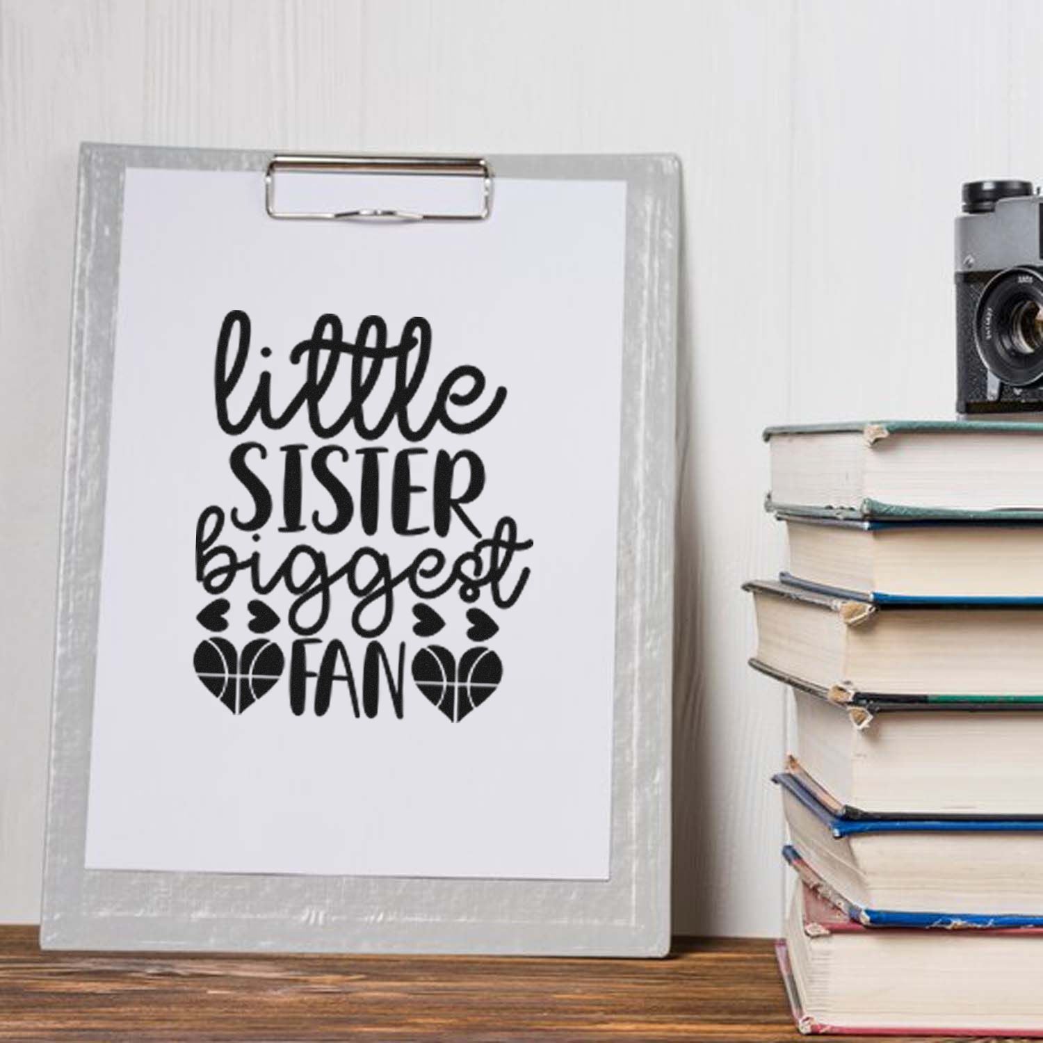 Little Sister Biggest Fan rubber stamp design on clipboard, perfect for sister-themed handmade cards and craft projects.