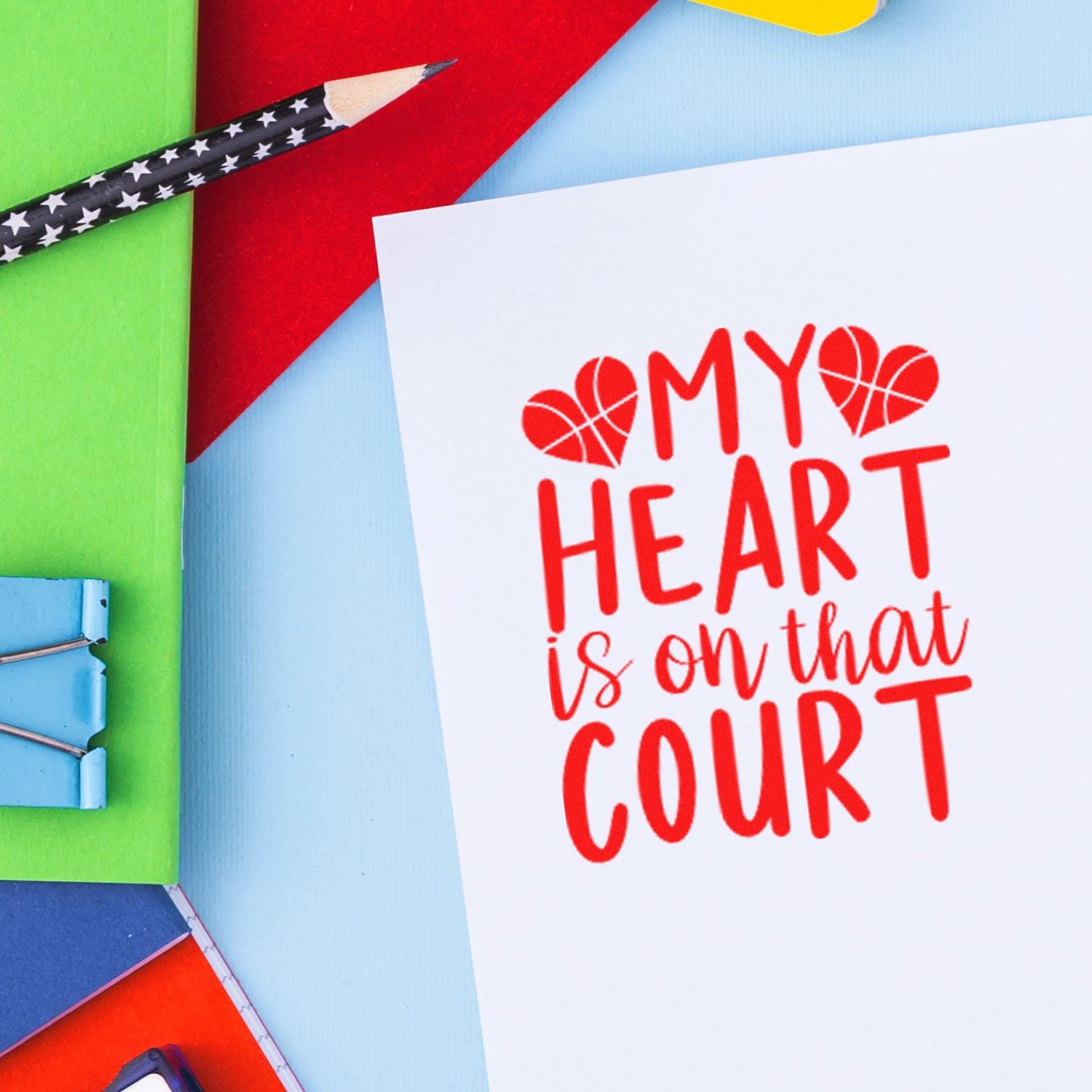 Sports-themed custom rubber stamp reading My Heart Is on That Court with basketball heart icons on a white card.