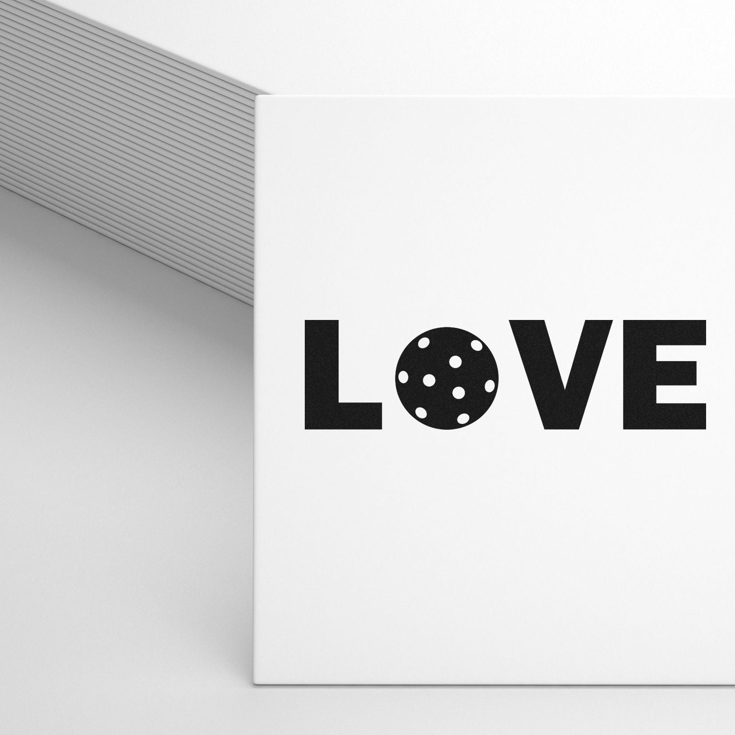 Custom rubber stamp design reading LOVE with polka dot O on white stationery, perfect for wedding and Valentine crafts.