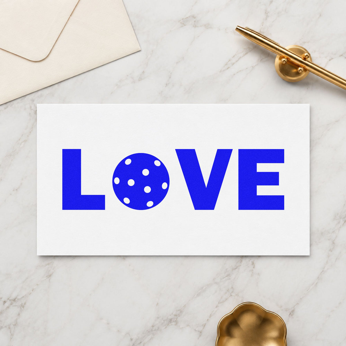 Love Pickleball Ball Letter craft stamp in blue ink on cardstock, an easy option for court towel printing.