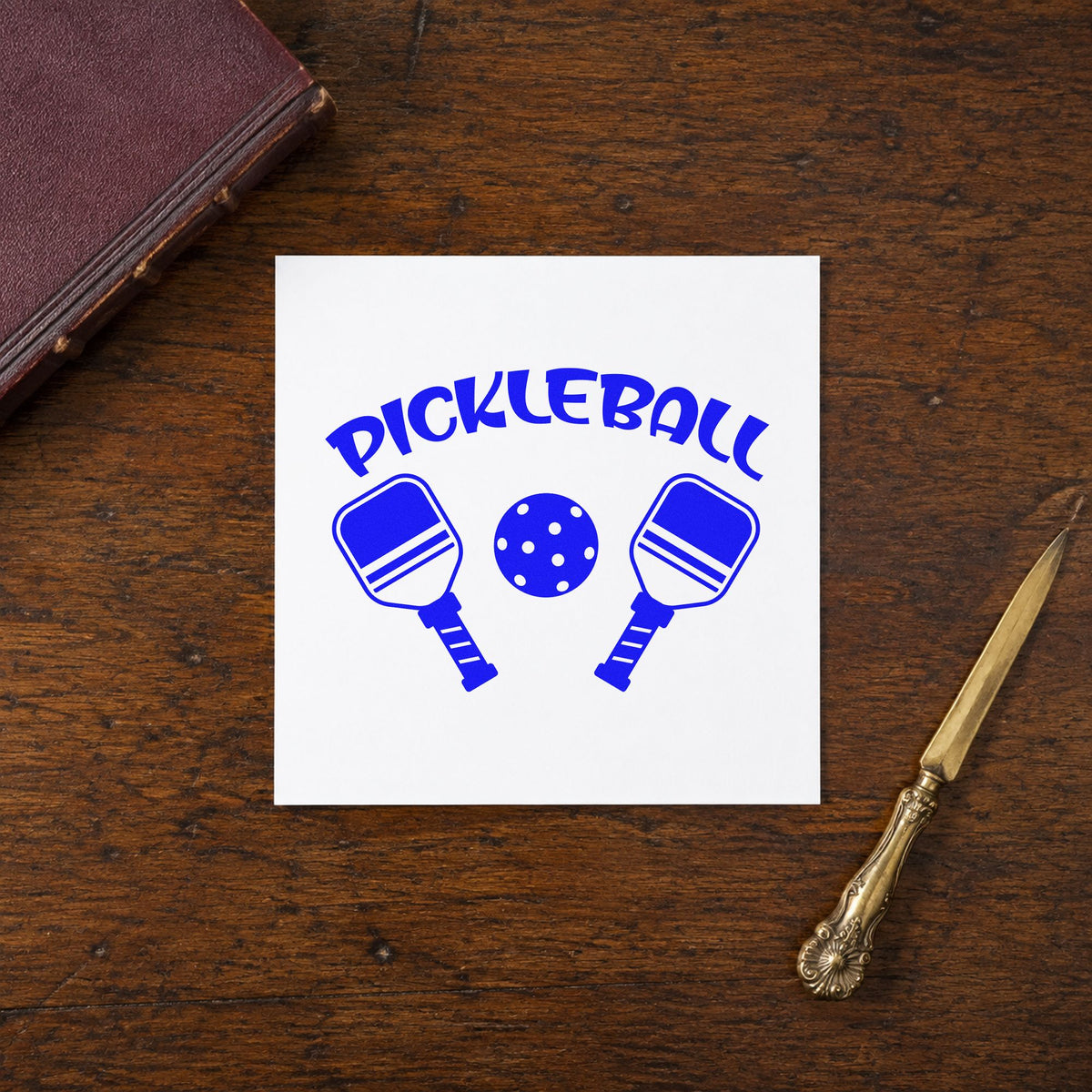 Pickleball Paddles And Ball craft stamp in blue ink on cardstock, an easy option for divider curtain printing.