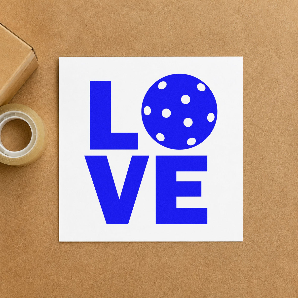 Stacked Love Pickleball Ball craft stamp imprinted in blue ink on paper, a design suited to framed court shelter.
