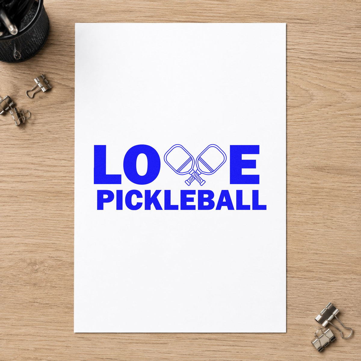 Love Pickleball Crossed Paddles craft stamp in blue ink on cardstock, an easy option for counter cloth printing.