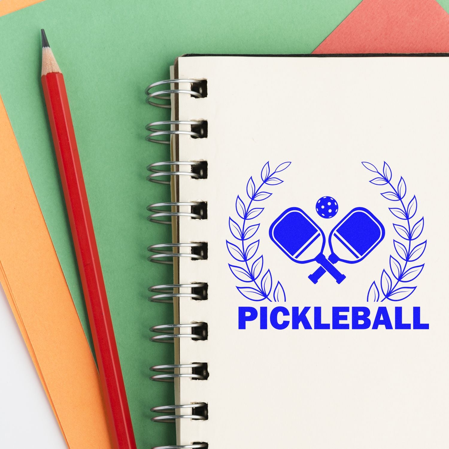 Custom pickleball rubber stamp design with crossed paddles and laurel wreath for sports branding and crafts