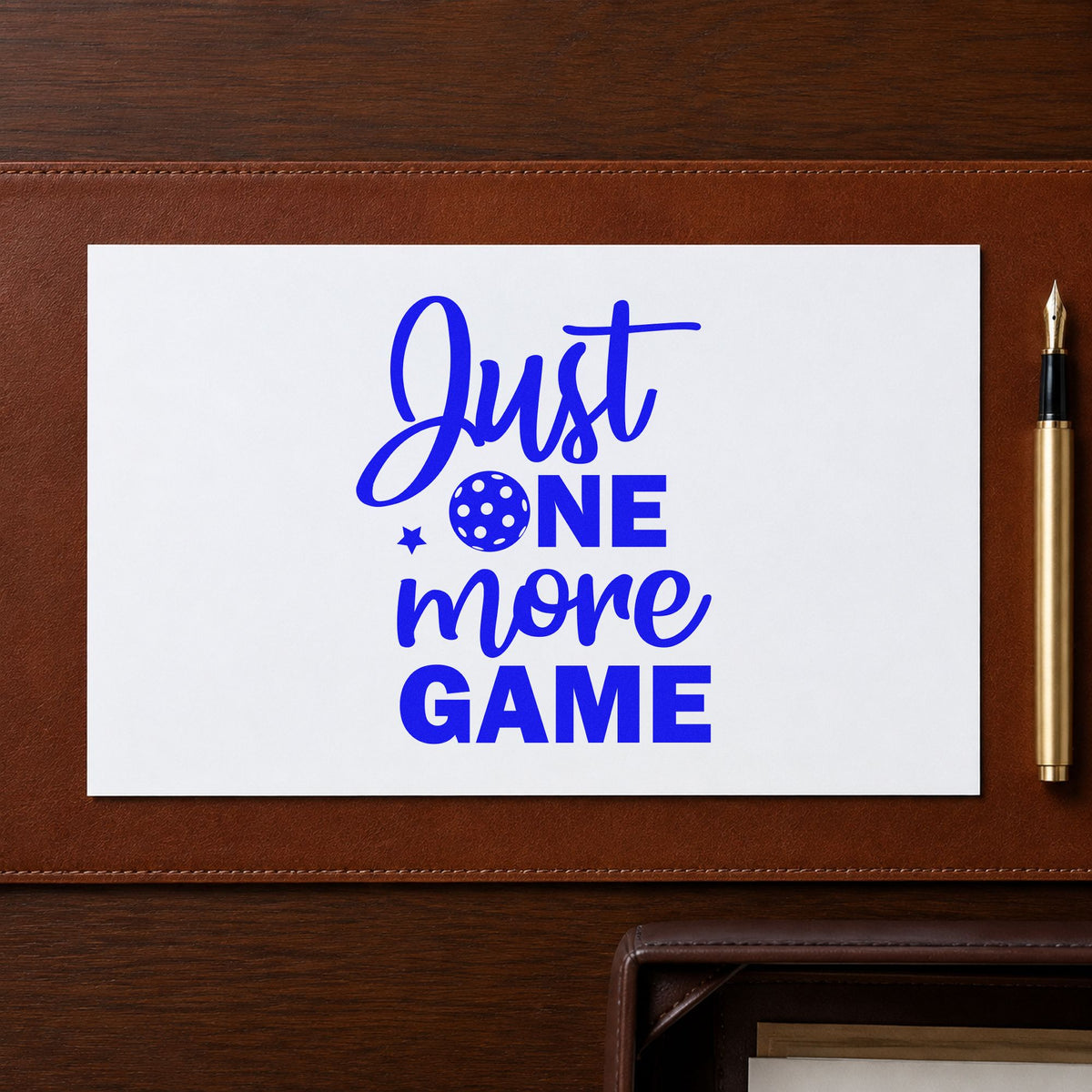 Just One More Game craft stamp imprinted in blue ink on paper, a design suited to framed court board.