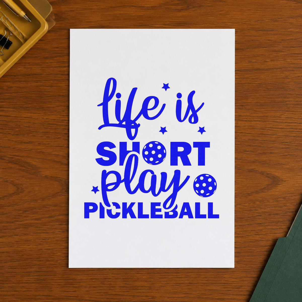 Life Short Play Pickleball craft stamp in blue ink on cardstock, an easy option for bench cushion printing.