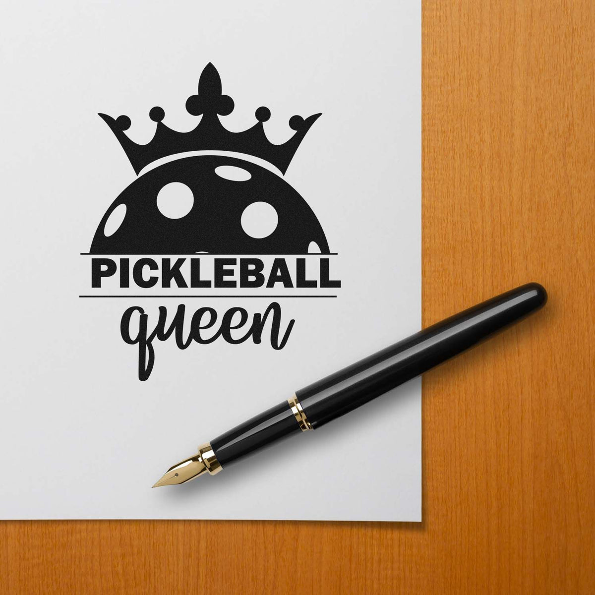 Pickleball Queen Crowned Ball Crown Premium Wooden Stamp - Vintage Pro imprint stamped in black ink. A crown tops a half perforated ball above PICKLEBALL queen.