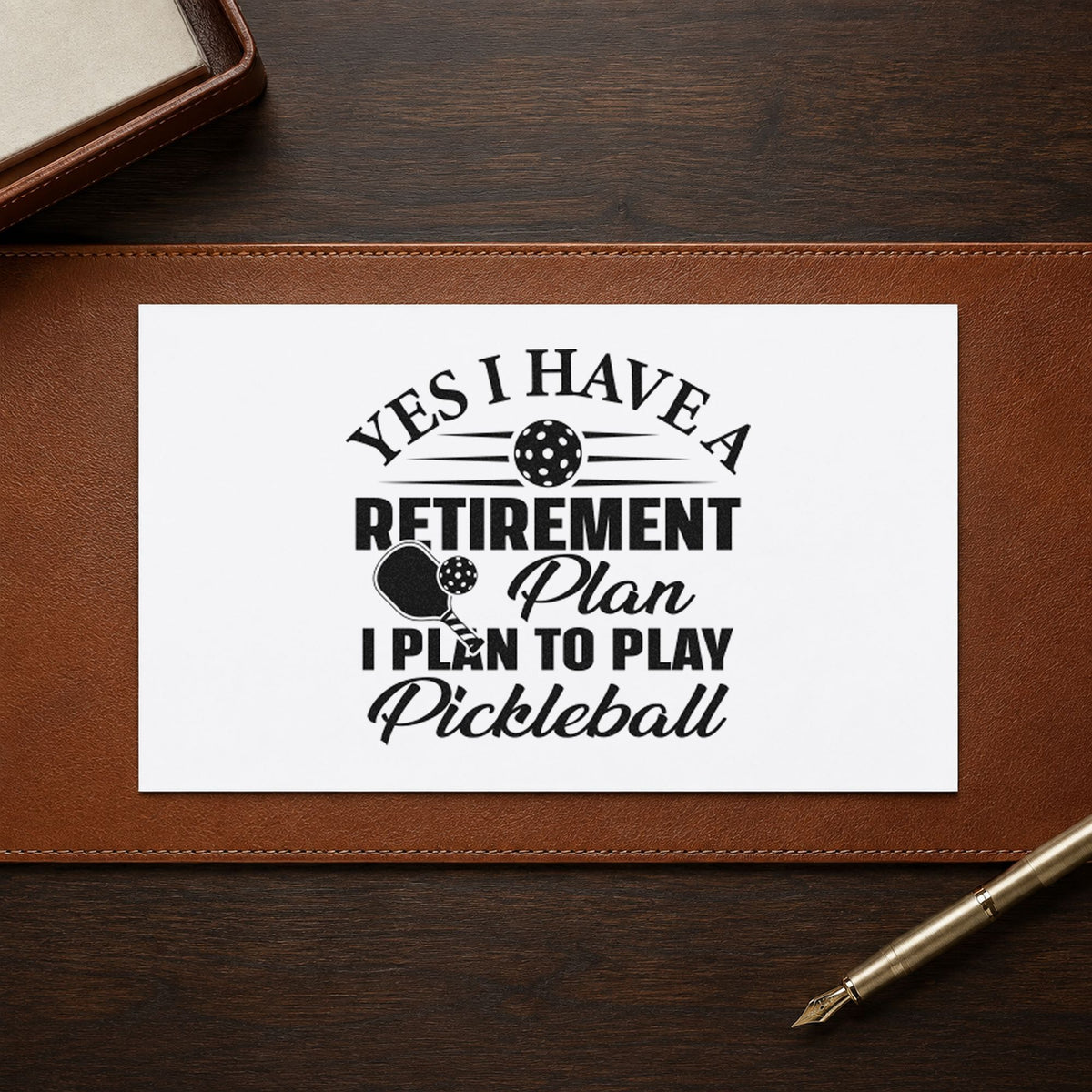 Retirement Plan Play Pickleball craft stamp in black ink on cardstock, an easy option for retirement album page.