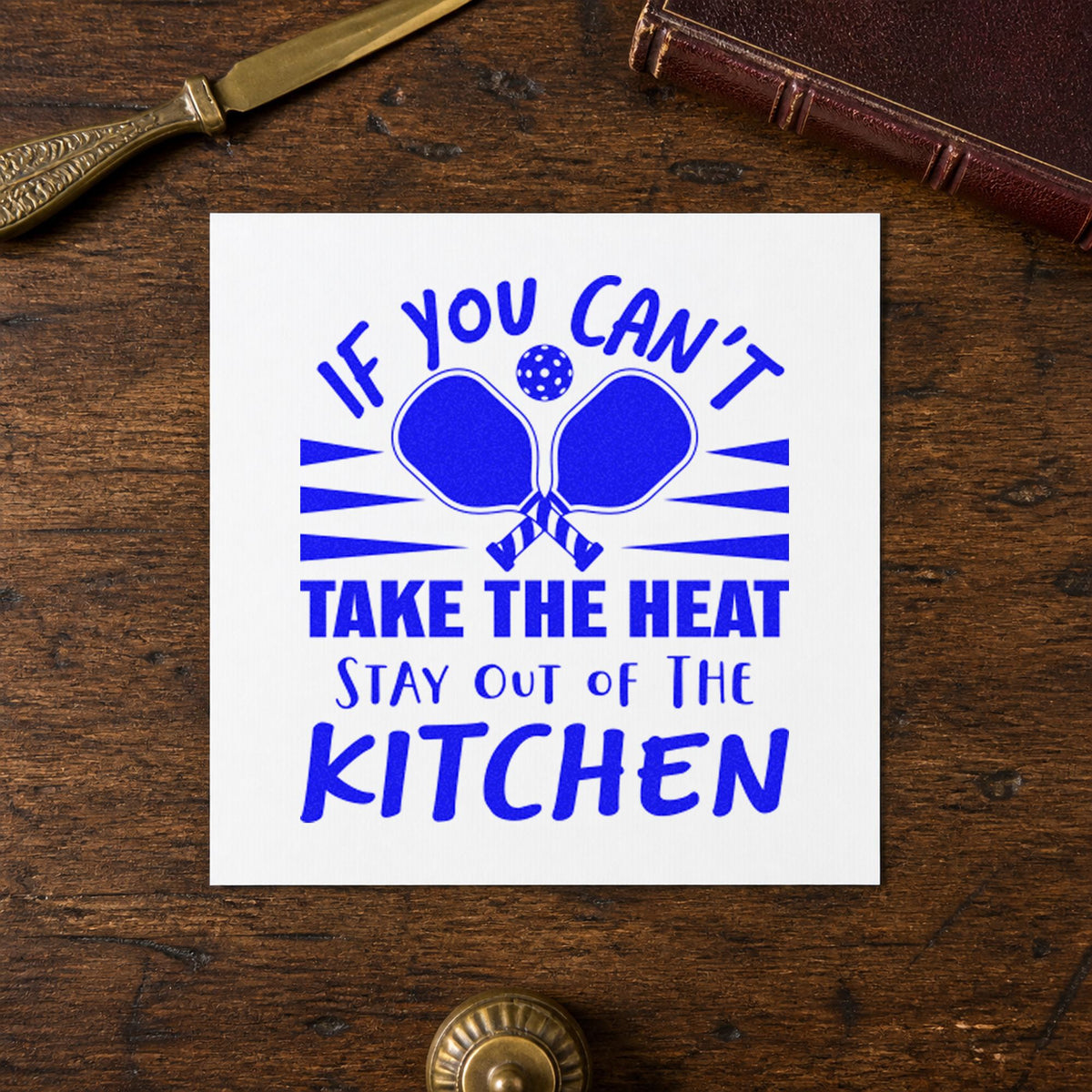 Heat Stay Out Kitchen craft stamp in blue ink on cardstock, an easy option for table cloth printing.
