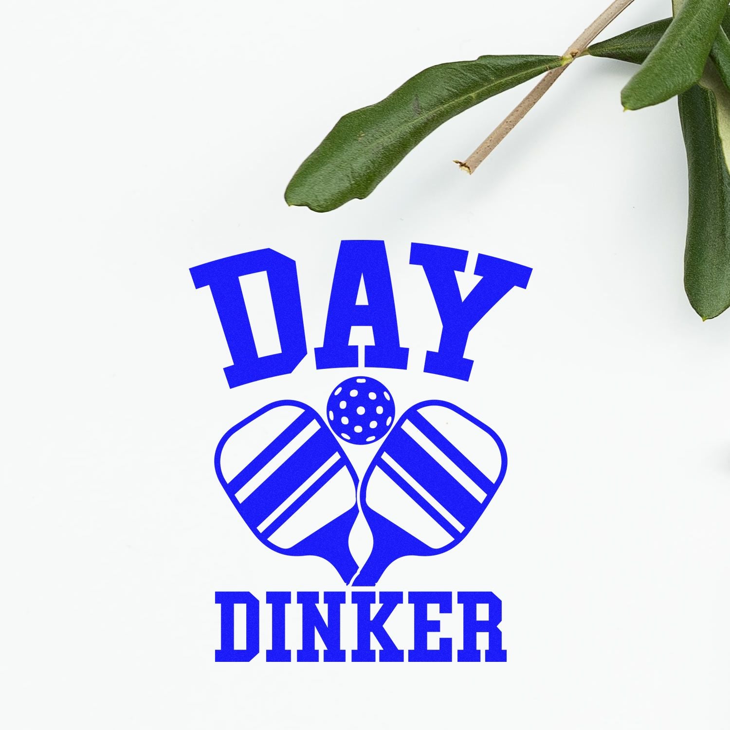 Day Dinker pickleball rubber stamp design with paddles and ball in blue on a clean white background